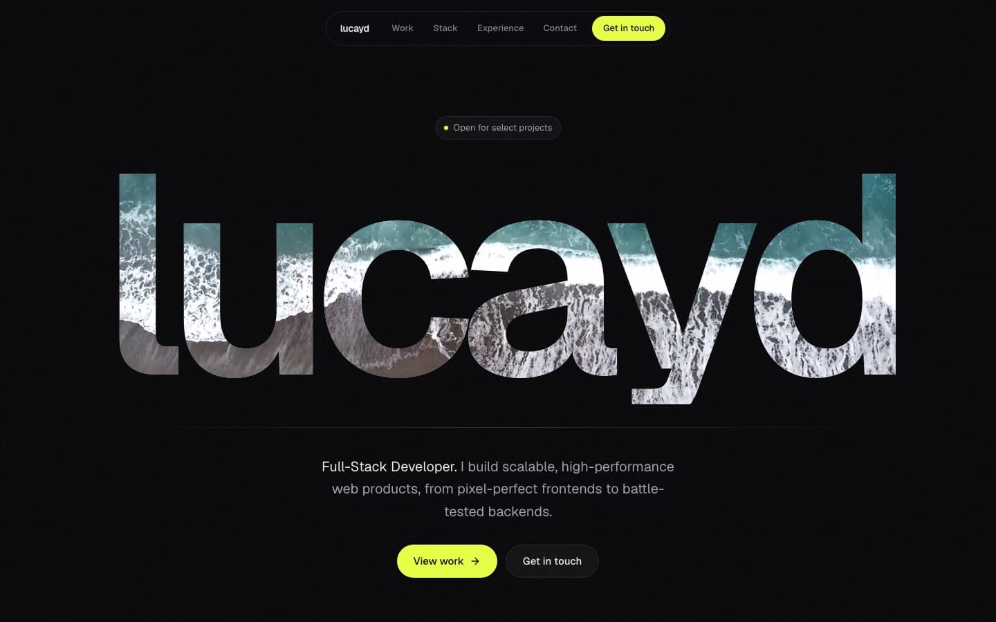 The lucayd.space website, hero with a headline filled by ocean video